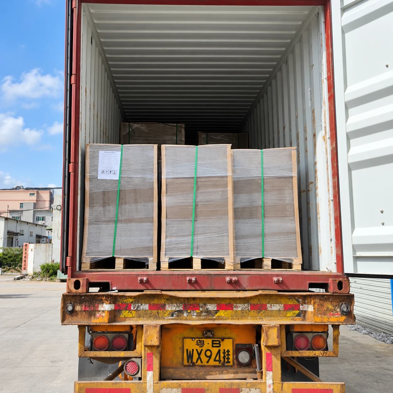 Wrapped sheet pallets loaded in an export container