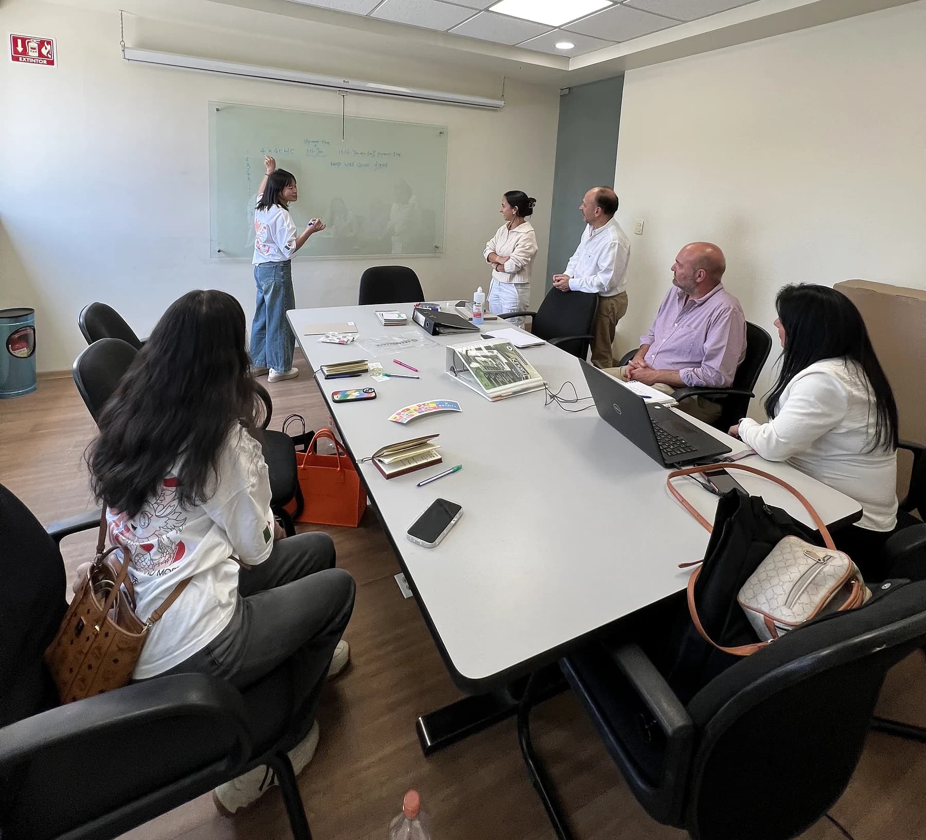 Reviewing paper samples during a customer meeting