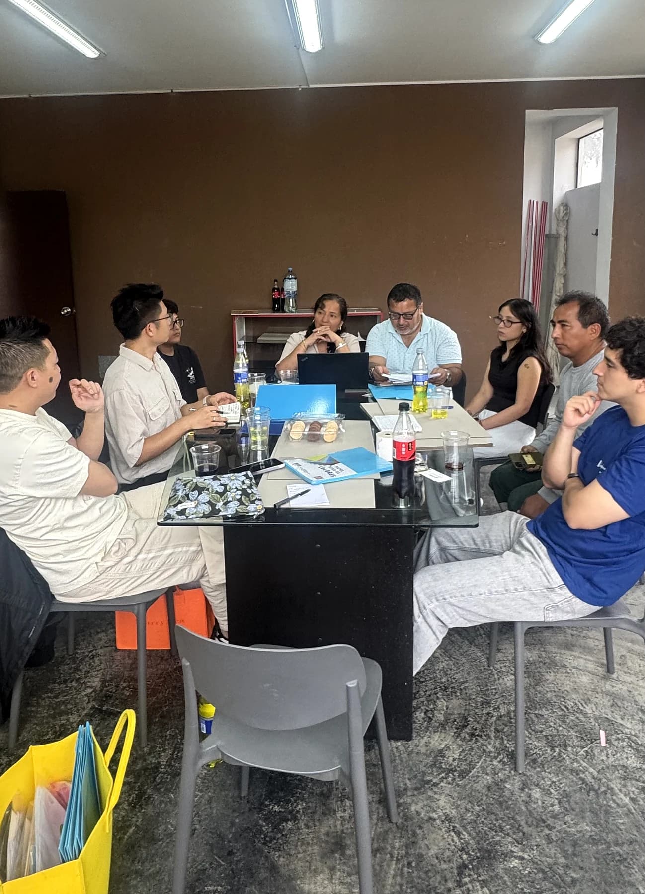 Discussing paper samples around the meeting table